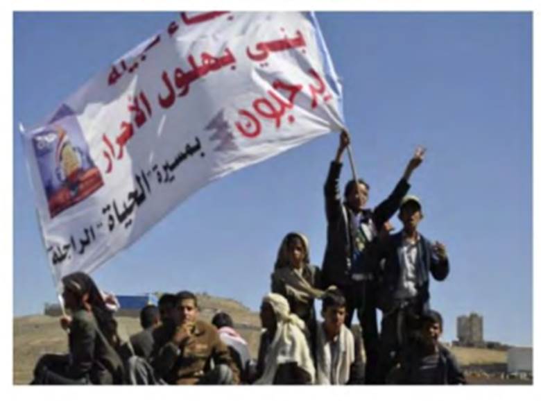 A group of people holding a flagAI-generated content may be incorrect.